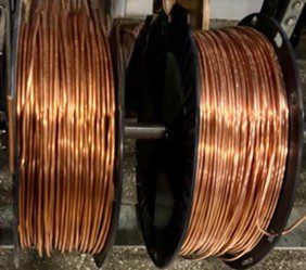 Two spools of copper wire side by side.