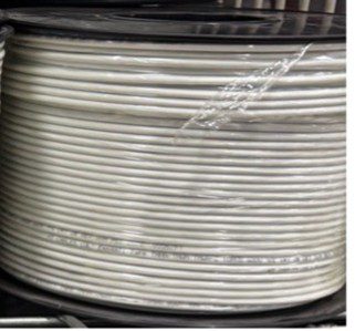 A spool of white electrical wire tightly wound and wrapped in plastic.