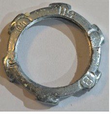 A metal locking ring with multiple notches and markings.