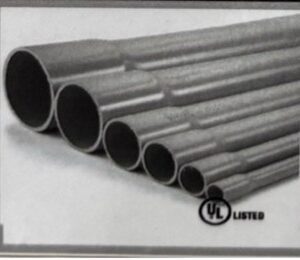 Stacked metal pipes of varying diameters arranged in descending order.