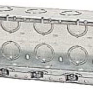 Close-up of a metallic hinge with circular cutouts and screws.