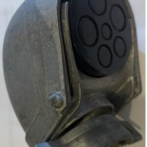 Close-up of a metallic device with circular rubber pads.